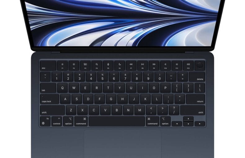 Laptop moderno con schermo astratto blu